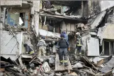  ?? AP photo ?? Rescuers work at a site of an apartment building destroyed by Russian shelling in Bakhmut, Donetsk region, Ukraine on Wednesday.
