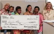  ??  ?? Better Homes and Gardens Real Estate Gary Greene Champions office manager Sharon Teusink (right to left), agent Nathania Reed, and Jasmine Reed and her family celebrate winning $1,000 from the company.