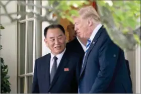  ?? ANDREW HARNIK — THE ASSOCIATED PRESS ?? President Donald Trump talks with Kim Yong Chol, former North Korean military intelligen­ce chief and one of leader Kim Jong Un’s closest aides, as they walk from their meeting in the Oval Office of the White House in Washington, Friday.