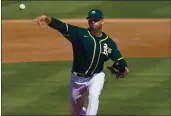  ?? MATT YORK — THE ASSOCIATED PRESS ?? A’s pitcher James Kaprielian throws against the Angels during their spring game on Friday in Mesa, Ariz.