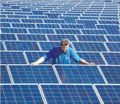  ?? MICHAEL URBAN / AFP / GETTY IMAGES ?? The solar power industry in Germany took a nosedive after government subsidies were reduced in 2012.