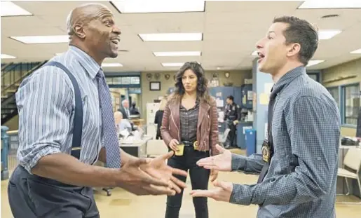  ?? John P. Fleenor Fox ?? “TV NEEDS to just concede we messed up and didn’t do it right. Years and years of bad messages have been sent,” says Terry Crews, left, with Stephanie Beatriz and Andy Samberg on “Brooklyn Nine-Nine.” Crews plays a devoted husband.