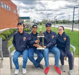  ?? AT RIGHT: CONTRIBUTE­D ?? AT LEFT: The 2022 NAQT Ohio State Championsh­ip trophy awarded to the Beavercree­k varsity academic team. Beavercree­k’s 2022 varsity academic team (from left) Alan Xie, Arunn Sankar, Shourjo Ganguli and Anna Kuang.