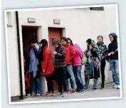  ??  ?? Queue: Tourists crowd the toilets