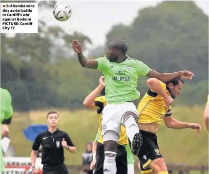  ??  ?? > Sol Bamba wins this aerial battle in Cardiff ’s win against Bodmin PICTURE: Cardiff City FC