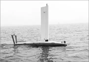  ??  ?? An Ocean Aero Submaran S10 parks itself on the ocean surface, sail extended. — Ocean Aero photo