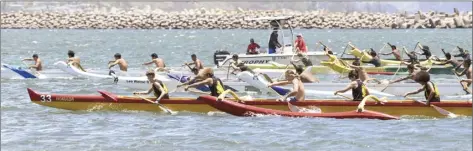  ??  ?? Photos from top: Na Kai Ewalu’s Girls 18 crew (foreground) takes an early lead at trhe start of Saturday’s race ◆ Crews break from the starting line in the Boys 16 race
◆ Boys 18 crews make their turns Saturday at Kahului Harbor.