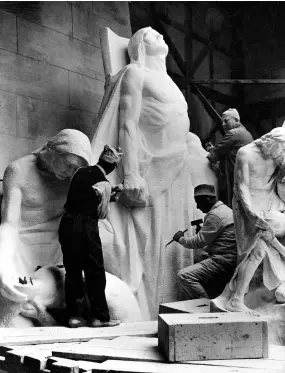  ??  ?? Above: Stone carvers work on the monument’s allegorica­l figures. Opposite page: Canadian students at Vimy Ridge in 2013.