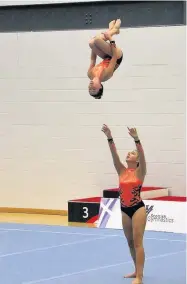  ??  ?? Champions The duo perfected their somersault and were crowned Scottish champions