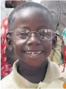  ??  ?? ●●A Zambian child gets a pair of glasses