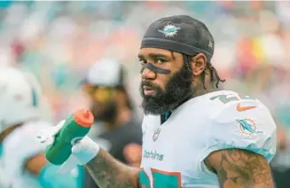  ?? ALEX MENENDEZ/AP ?? Dolphins cornerback Xavien Howard Watches from the sideline during a game against the Vikings on Oct. 16 in Miami Gardens.