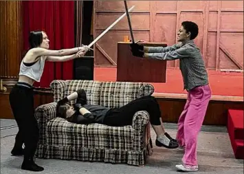  ?? Marissa Lounello / ?? From left: Sydney Davis, Ash Visker and Leah John rehearse an action sequence for Confetti Stage's "She Kills Monsters."