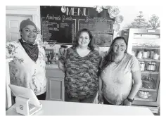  ?? NICOLE SULLIVAN • CAPE BRETON POST ?? Not Just Cakes owner Tara Parsons-Donovan, right, with cake decorator Krystina Hartigan, middle, and baker/pastry chef Amber Best at the Sydney River shop. The three competed as Team Sugar and Spice in an upcoming episode of "The Big Bake: Halloween" — leaving the women with a big secret to keep.