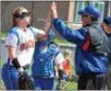  ?? KYLE MENNIG – ONEIDA DAILY DISPATCH ?? Oneida coach Mike Curro, right, congratula­tes pitcher Kylie Chesebro after the seventh inning of Monday’s victory over Jamesville-DeWitt.