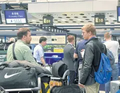  ?? AP ?? Foreign journalist­s prepare to leave for North Korea at Beijing airport yesterday. Pyongyang is allowing the small media group access to its nuclear test site.