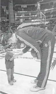  ?? Houston Chronicle file ?? Rockets center Yao Ming shakes hands with Noah Byars, 3, while warming up before an Oct. 30, 2010, game against the Denver Nuggets at the Toyota Center in Houston.