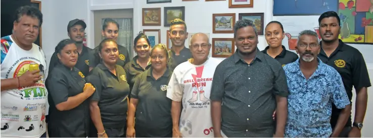  ?? Photo: Waisea Nasokia ?? Nana’s Indian Cuisine director Sham Naidu (standing front row sixth from left) and his father Satish Narayan (standing front row seventh from left) during the soft opening at Sagayam Road, Nadi Town on May 21, 2020.