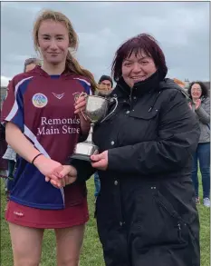  ??  ?? Bunclody captain Muireann Doyle receives the cup from County Secretary Kathleen Kehoe.
