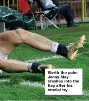  ??  ?? Worth the pain: Jonny May crashes into the flag after his crucial try