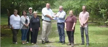  ?? PILOT NEWS GROUP PHOTO/JAMES MASTER ?? Visit Marshall County awards $25,000 to Potawatomi Wildlife Park. Pictured in the photo from left to right: Kim Berger, Jessica Beatty, Larry and Tana Beeson, Mark Vanderweel­e, Mark Espich, Lacey Pfeiffer, and Nick Treber.