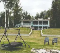  ??  ?? The original 1,700-square-foot cabin, which sits on a secluded lot.