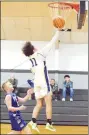  ?? Westside Eagle Observer/MIKE ECKELS ?? Ricky Thor (11) puts up a jumper from the freethrow line during the Thursday night DecaturMia­mi, Okla., eighthgrad­e basketball game in Jay, Okla. The Bulldogs defeated the Wardogs to win the consolatio­n round and third place in the Jay Junior High Basketball Tournament.