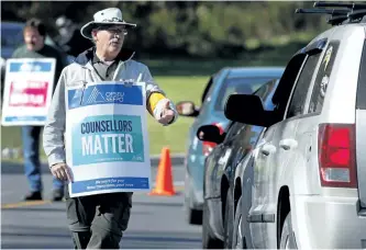  ?? CLIFFORD SKARSTEDT/EXAMINER ?? Academic staff at Fleming College stop motorists on the picket line Friday at the Sutherland Campus on Brealey Drive. Ontario Public Service Employees Union (OPSEU) Local 352 went on strike Monday. Local 352 represents about 250 full-time and partial...