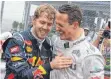  ?? FOTO: DPA ?? Sebastian Vettel (li.) mit seinem Vorbild und Freund.