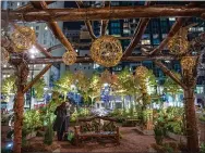  ?? MARISA FISCHETTE FOR CENTER CITY DISTRICT ?? Wintergard­en features topiaries and festive lights, ice skating with limited capacity, food and drink around fire pits.