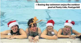  ??  ?? Boxing day swimmers enjoy the outdoor pool at Ponty Lido, Pontypridd