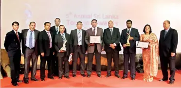  ??  ?? Aitken Spence Travels Senior Management Team with the top travel awards