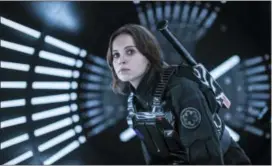  ?? JONATHAN OLLEY — LUCASFILM LTD. VIA AP, FILE ?? This file image released by Lucasfilm Ltd. shows Felicity Jones as Jyn Erso in a scene from “Rogue One: A Star Wars Story.” The “Star Wars” spinoff “Rogue One” has led the box office for the third straight week, taking in an estimated $64.3 million...