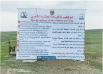  ?? (Seth J. Frantzman) ?? A SIGN posted outside a refugee camp at Hamam al-Alil lists Popular Mobilizati­on Forces instructio­ns.