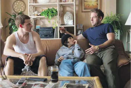  ?? TOBIN YELLAND/A24 VIA AP ?? Writer-director Jonah Hill, right, with cast members Lucas Hedges, left, and Sunny Suljic during the filming of Mid90s.