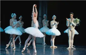  ??  ?? This file photos show French ballerina Leonore Baulac of the Paris Opera Ballet performing during Ilyich Tchaikovsk­y’s Swan Lake (Lac des cygnes) at the Bastille Opera house, in Paris. — AFP photos