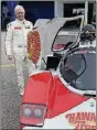  ?? PHOTO BY DALE OAKES ?? John Higgins poses in the pits with the 1985 Porsche Fabcar.