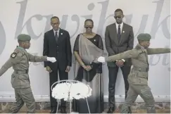  ??  ?? 0 President Paul Kagame, first lady Jeannette Kagame and son Ivan prepare to lay wreaths at the Kigali Genocide Memorial