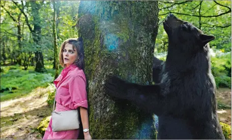  ?? PAT REDMOND/UNIVERSAL PICTURES VIA AP ?? Keri Russell in a scene from “Cocaine Bear,” directed by Elizabeth Banks.