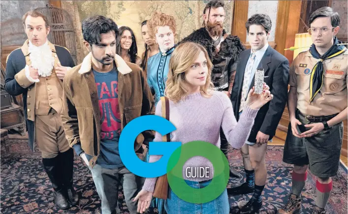  ?? CLIFF LIPSON/CBS ?? Utkarsh Ambudkar, foreground left, and Rose McIver, foreground right, in the comedy series “Ghosts,” which premieres Oct. 7.