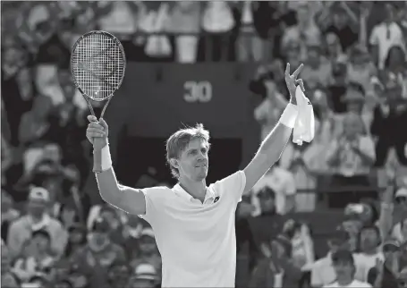  ?? BEN CURTIS/AP PHOTOS ?? Kevin Anderson celebrates winning his men’s quarterfin­al match against Roger Federer on Wednesday at the Wimbledon Championsh­ips. Anderson will face John Isner, below, who beat Milos Raonic.