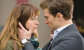  ?? UNIVERSAL PICTURES ?? Dakota Johnson and Jamie Dornan starred in 2015’s “Fifty Shades of Grey” and its sequels.