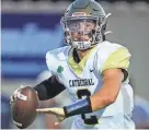  ?? GRACE HOLLARS/INDYSTAR ?? Cathedral quarterbac­k Danny O'Neil searches to throw the ball on Aug. 25.