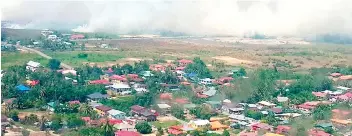  ??  ?? An aerial view of forest
fires in Papar.