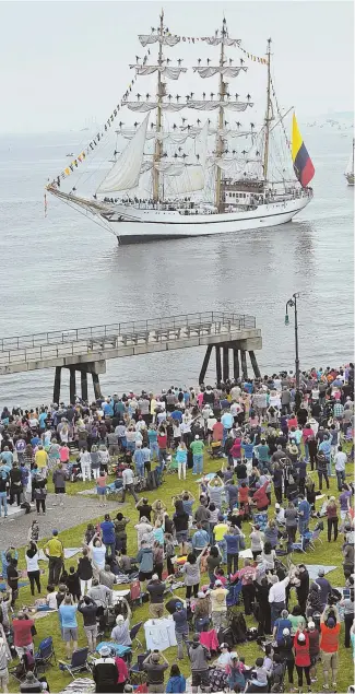  ?? STAFF PHOTOS BY NANCY LANE, TOP, LEFT AND RIGHT; PATRICK WHITTEMORE, LEFT; HERALD PHOTO BY MARK LORENZ, ABOVE ?? SEA SPECTACLE: The tall ship Guayas, left, sails past Castle Island in South Boston yesterday. At top left, sailors stand in the rigging of the U.S. Coast Guard ship Eagle. The Custom House can be seen in the background as the Pride of Baltimore sails...