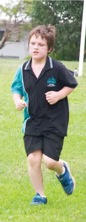  ?? ?? Issac Dean nears the end of his cross country race at Warragul Primary School.