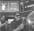  ?? RICHARD DREW/AP ?? Dutch Bros Coffee co-founder Travis Boersma rings the ceremonial first trade bell Wednesday on the New York Stock Exchange.