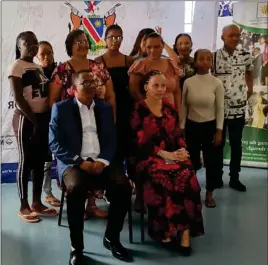  ?? Photo: Contribute­d ?? Beneficiar­ies… Patrick Jossob and Aletha Frederick (seated) with some of the trainees during the equipment handing over on Monday.