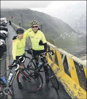  ?? SUBMITTED PHOTOS ?? Chris Macdougall of Truro and his niece Meg Macdougall of Halifax take a moment to celebrate their successful cycle to the summit of the Stelvio Pass of the Eastern Alps in Northern Italy during a recent fundraisin­g expedition to raise money for cancer research.