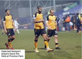  ??  ?? Dejected Newport players leave the field at Prenton Park