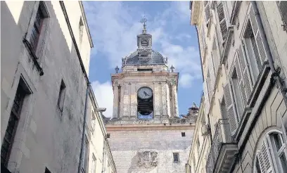  ??  ?? Edouard Normandin with his Cognac collection and the entrance to La Rochelle’s main square and waterfront